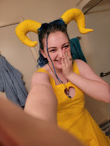 someone wearing a yellow dress with a heart cutout on the chest
